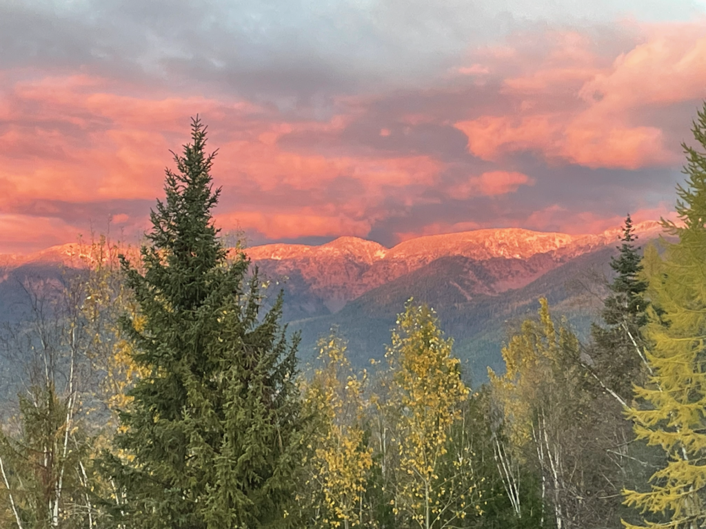 Amazingly bright pink sunrise on the snow capped peaks of the Swan Range.