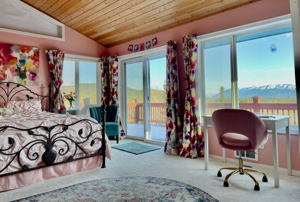 View of good-sized master bedroom and out sliding doors to deck.