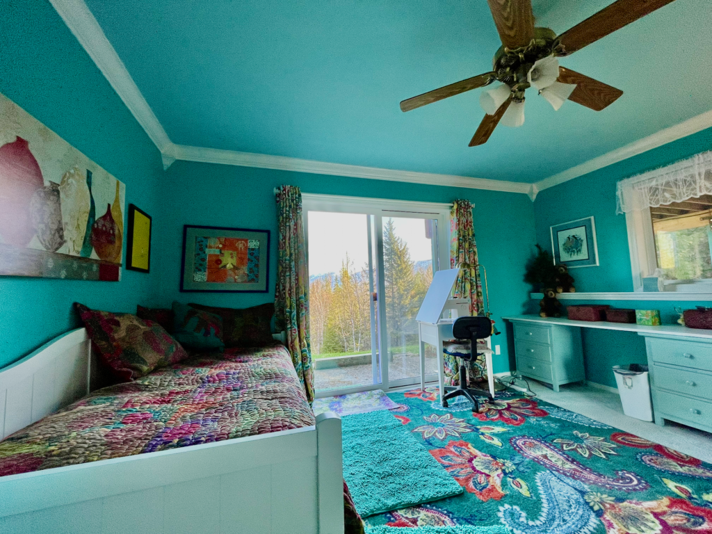 Second lower-level bedroom with sliding-door access to the back yard.