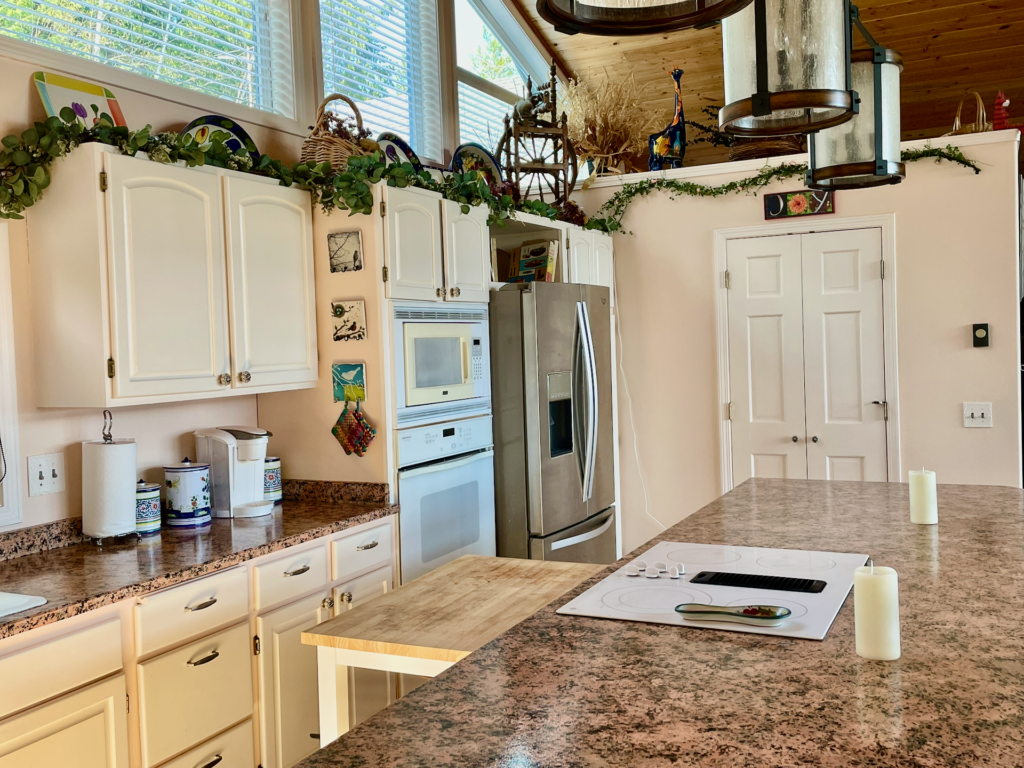 View of the kitchen from the porch door also showing the location of the large walk-in pantry.