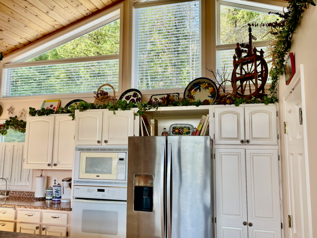 South-facing windows above the cabinets with motorized blinds allow for light and temperature control.