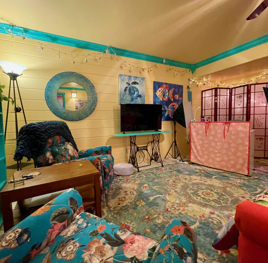 One side of a large media or recreation room. Paneling painted sunny yellow to match bonus room