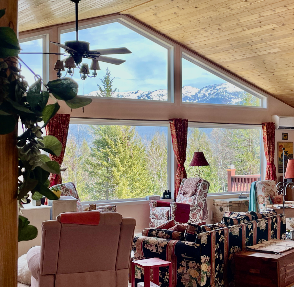 Proximity of snow capped peaks out the living room window, as seen from the top of the stairwell.