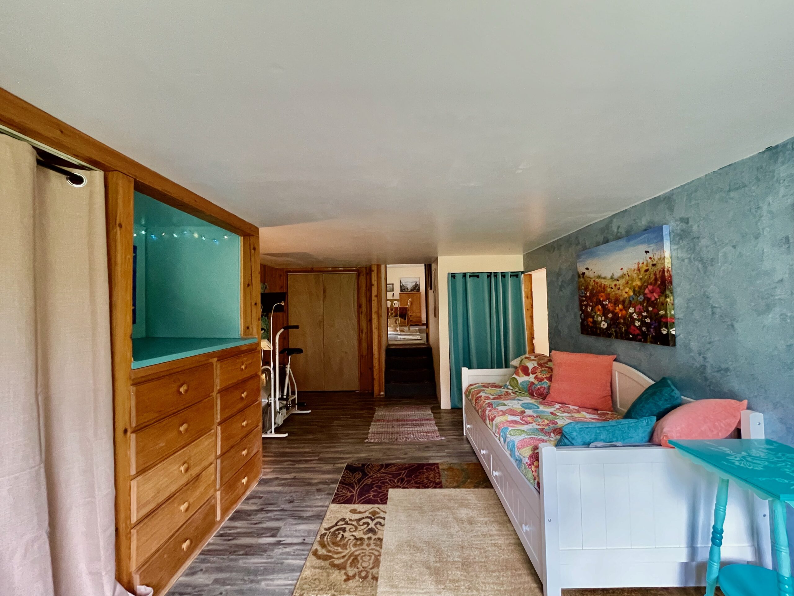 Bedroom with closet and built-in drawers as well as a three-quarter bath.