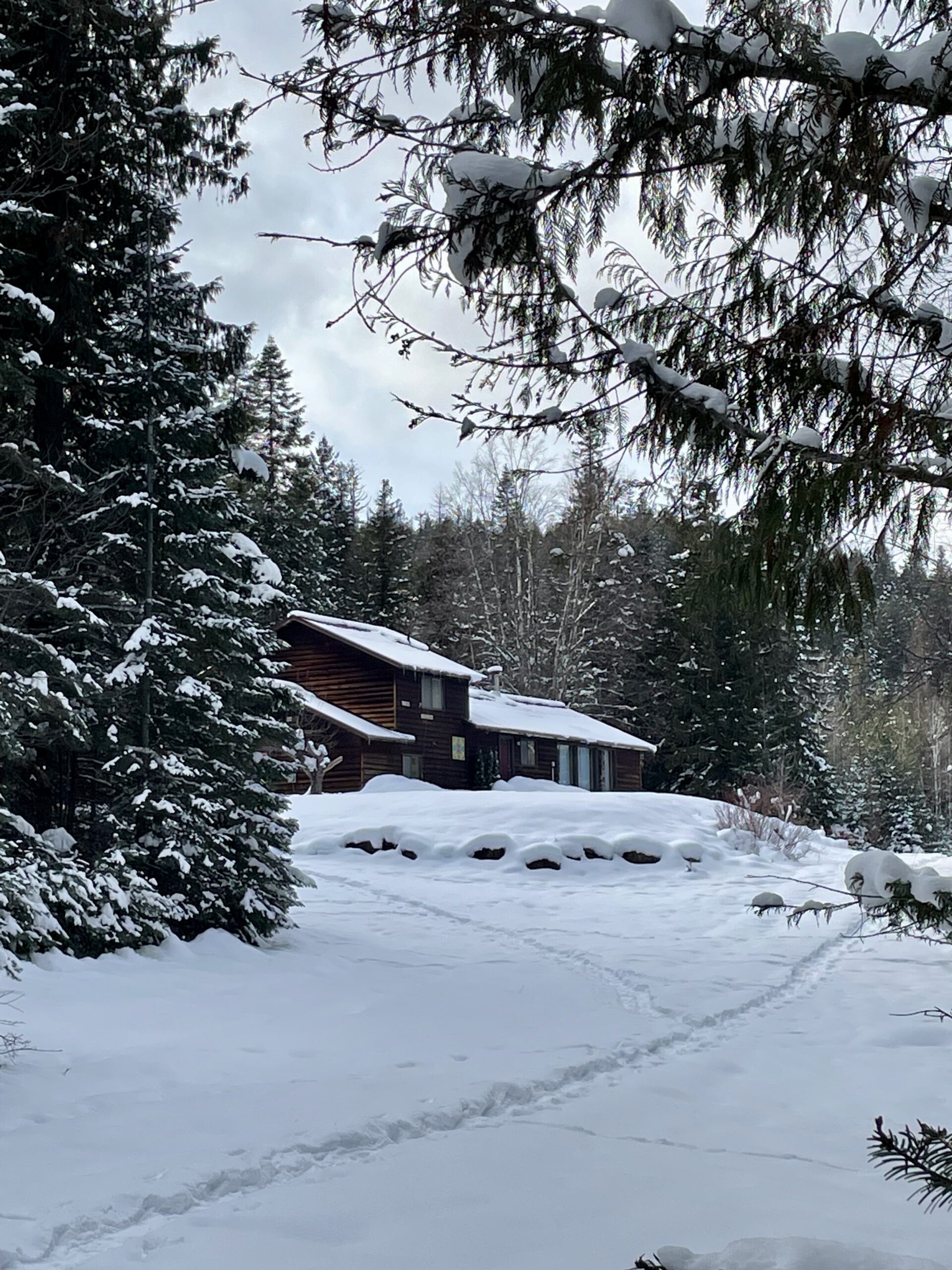 The view of the house transformed by the beauty of snow in the winter.